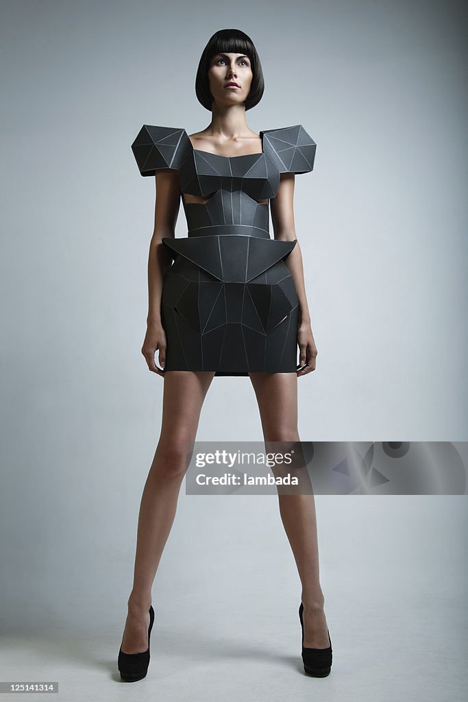 Fashion portrait of woman in futuristic dress
