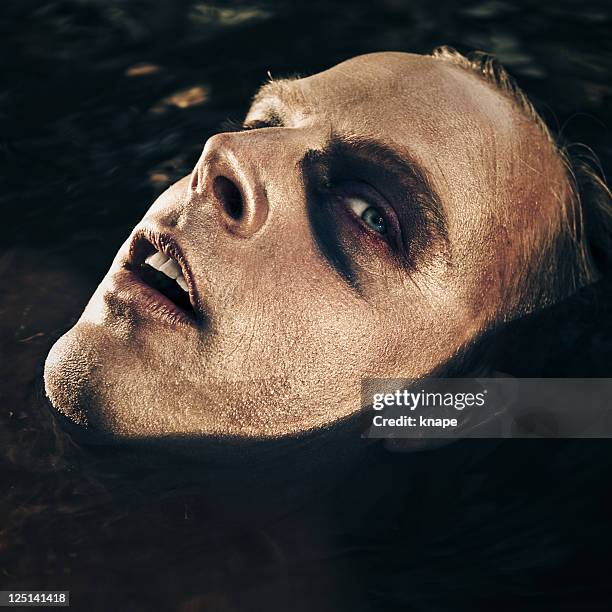 scary man surfacing from water - surfacing stock pictures, royalty-free photos & images