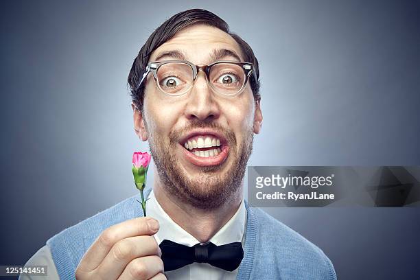 nerd student giving flower - ugliness stock pictures, royalty-free photos & images