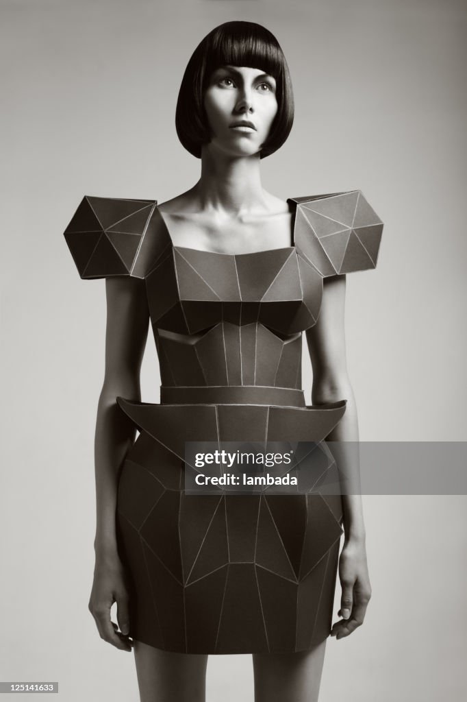 Fashion portrait of woman in futuristic dress