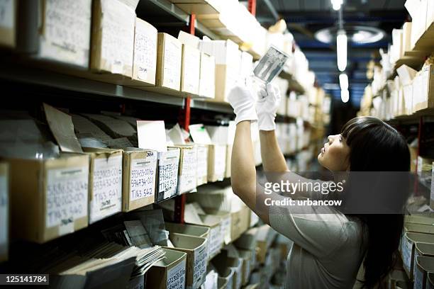 searching archives. - archival library stock pictures, royalty-free photos & images