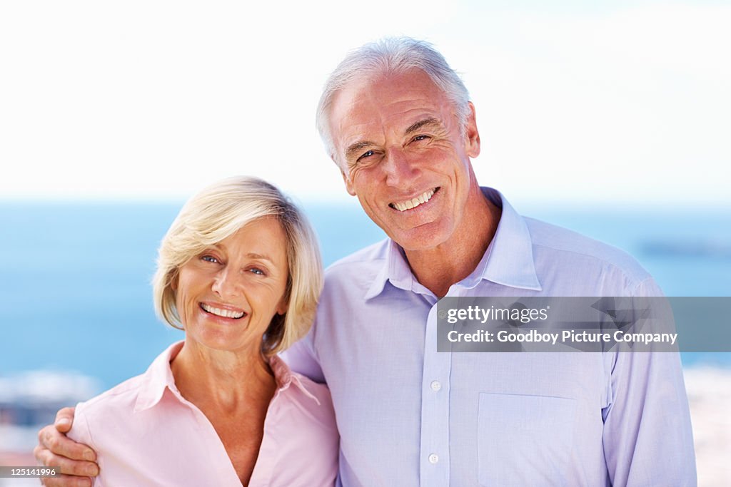 Happy senior couple smiling outdoors