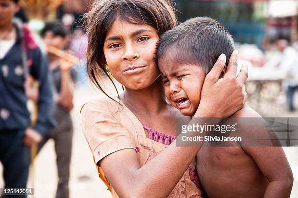 indian siblings boy crying - indian baby boy stock pictures, royalty-free photos & images