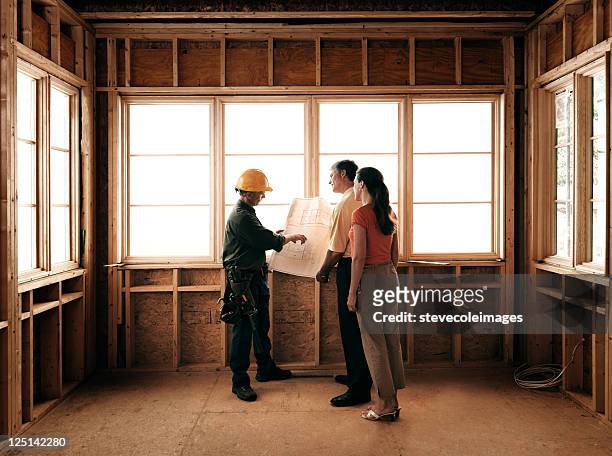 couple and builder - home interior stock pictures, royalty-free photos & images