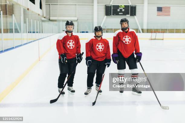 women's ice hockey offense player portrait - female ice hockey player stock pictures, royalty-free photos & images