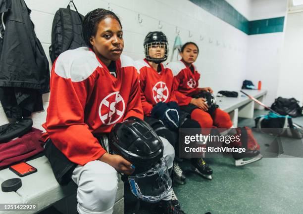 women's ice hockey player portrait - female ice hockey player stock pictures, royalty-free photos & images