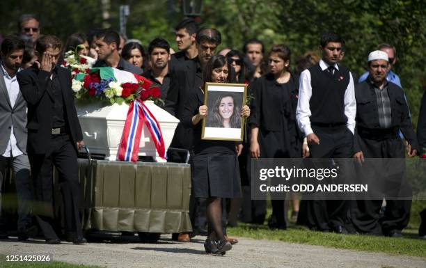 Close friend of Bano Rashid , one of the victims of the massacre on the youth camp of the Norwegian Labour Party walks ahead of her coffin carrying...