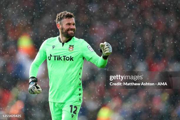 Ben Foster of Wrexham celebrates his side scoring a goal in the rain in the 3-2 victory during the Vanarama National League fixture between Wrexham...