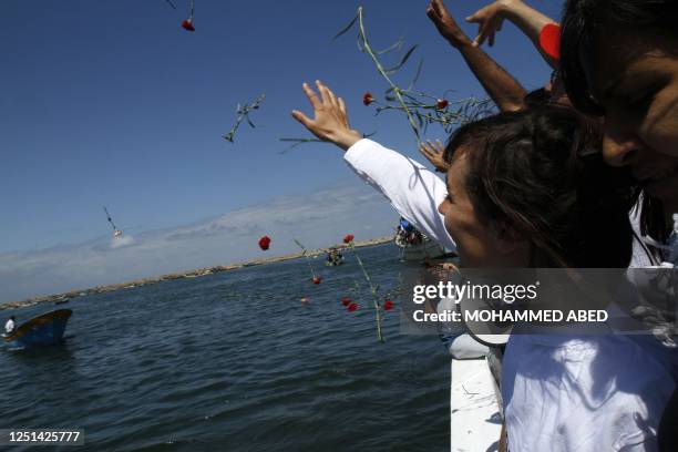 Members of International Solidarity Movement take part in a ceremony to mourn and denounce the kidnapping and killing of their colleague Italian...