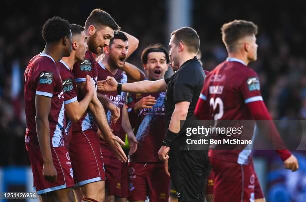 Louth , Ireland - 10 April 2023; Drogheda United players remonstrate with referee Kevin O'Sullivan after giving a penalty to St Patrick's Athletic...