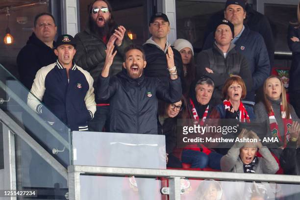 Wrexham Football Club owners Rob McElhenney and Ryan Reynolds watch their team during the Vanarama National League fixture between Wrexham and Notts...