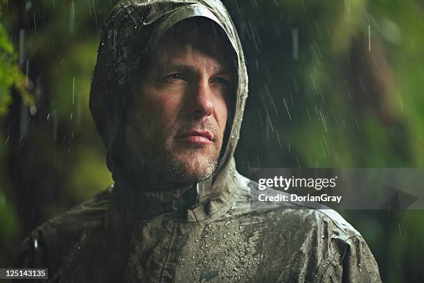 epic hiker - raincoat stock pictures, royalty-free photos & images