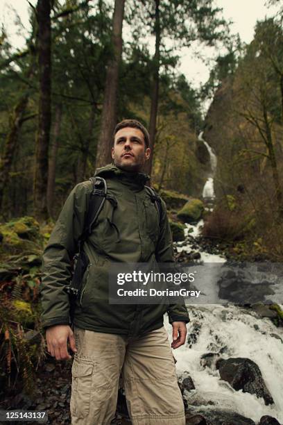 epic hiker - raincoat stock pictures, royalty-free photos & images