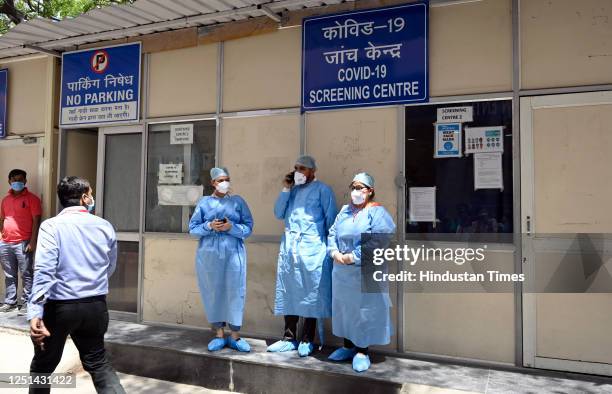 Healthcare workers during a mock drill to check COVID-19 preparedness amid rising cases of coronavirus, at RML Hospitalon April 10, 2023 in New...