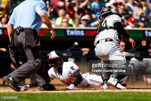 Nick Gordon of the Minnesota Twins scores a run against Yasmani Grandal of the Chicago White Sox on an RBI double by Matt Wallner of the Minnesota...
