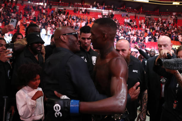 Israel Adesanya celebrates his victory with Kamaru Usman in their middleweight fight during the UFC 287 event on April 8 at the Kaseya Center in...