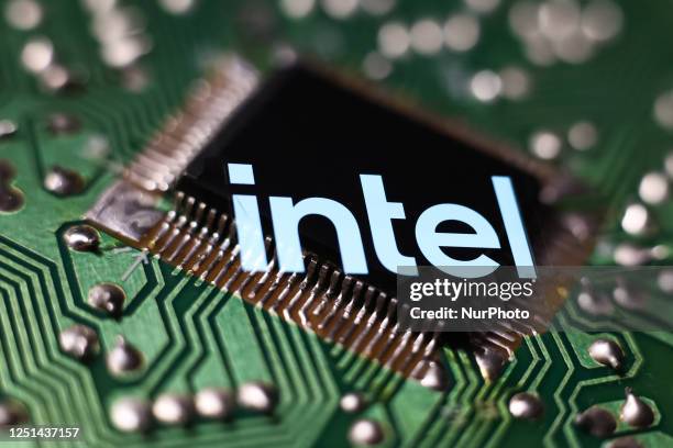 Microchip and Intel logo displayed on a phone screen are seen in this multiple exposure illustration photo taken in Krakow, Poland on April 10, 2023.