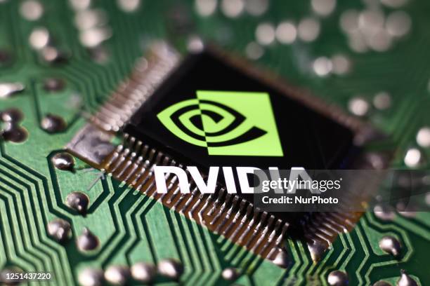 Microchip and Nvidia logo displayed on a phone screen are seen in this multiple exposure illustration photo taken in Krakow, Poland on April 10, 2023.