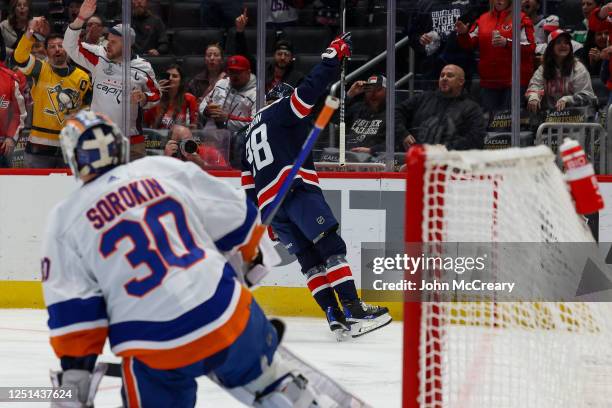 Rasmus Sandin of the Washington Capitals celebrates a first period goal during a game against the New York Islanders at Capital One Arena on April...