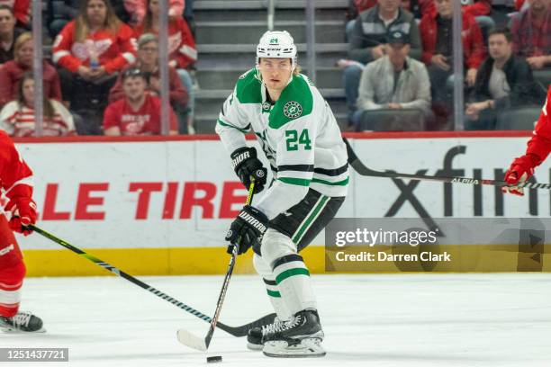 Roope Hintz of the Dallas Stars looks to pass the puck during the first period against the Detroit Red Wings in an NHL game at Little Caesars Arena...