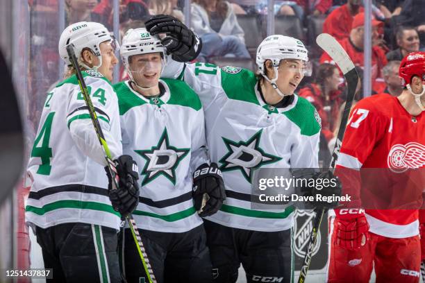 Esa Lindell of the Dallas Stars celebrates his goal against the Detroit Red Wings with teammates Roope Hintz and Jason Robertson during the first...