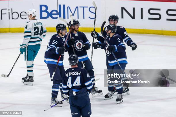 Mark Scheifele, Josh Morrissey, Kyle Connor, Dylan DeMelo and Pierre-Luc Dubois of the Winnipeg Jets celebrate a first period goal against the San...