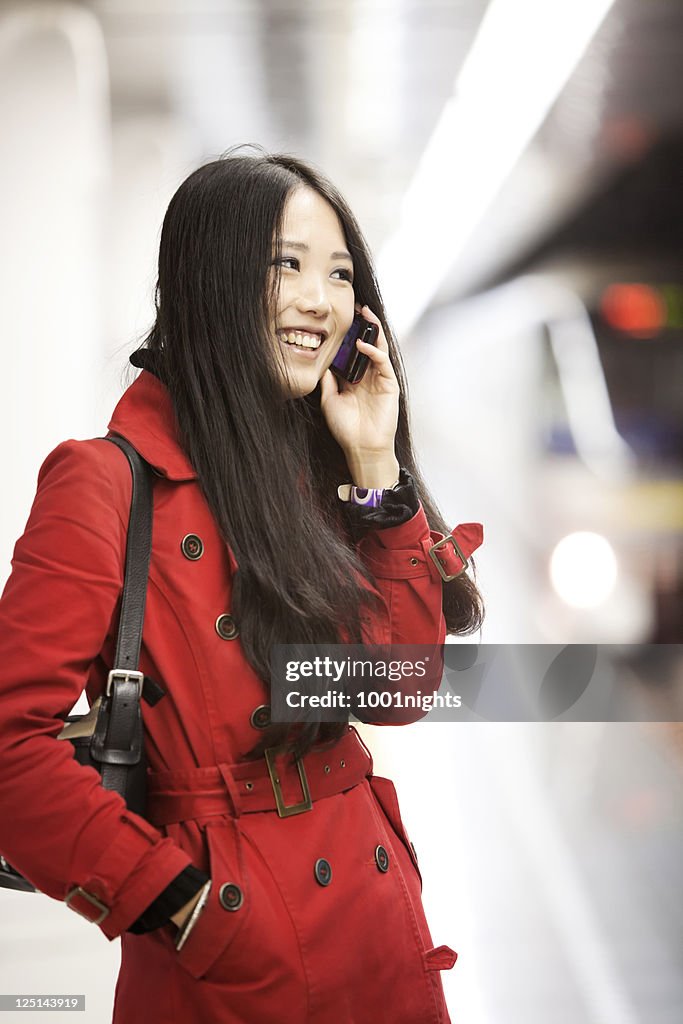 Beautiful Asian at the metro station