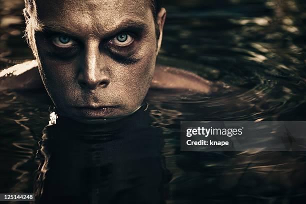 scary man surfacing from water - surfacing stock pictures, royalty-free photos & images