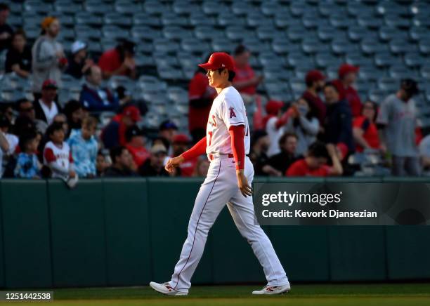 Shohei Ohtani of the Los Angeles Angels warms up before the game against Washington Nationals at Angel Stadium of Anaheim on April 10, 2023 in...