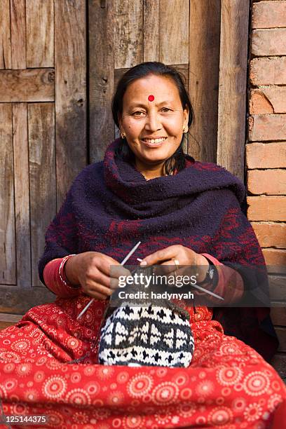 nepali woman kniting wool hat. bhaktapur. - nepal women stock pictures, royalty-free photos & images