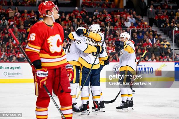 Nashville Predators Left Wing Egor Afanasyev celebrates with teammates after scoring a goal during the first period of an NHL game between the...