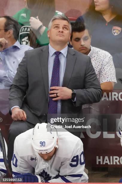 Head coach Sheldon Keefe of the Toronto Maple Leafs watches a replay during third period action against the Florida Panthers at the FLA Live Arena on...