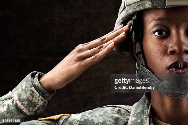 female african american soldier series: against dark brown background - armed forces stock pictures, royalty-free photos & images