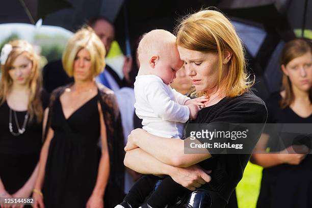 mother and baby at a funeral - child beauty pageant stock pictures, royalty-free photos & images