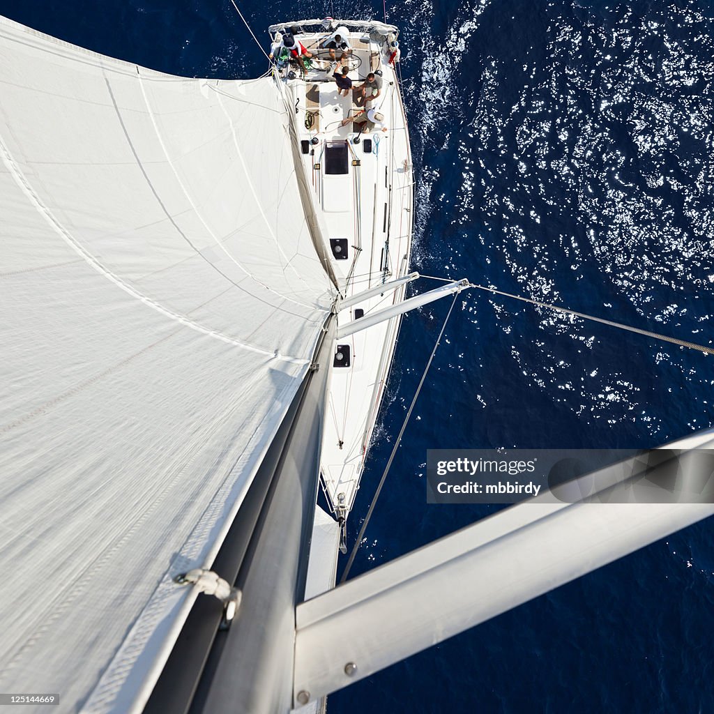 Sailing crew on sailboat