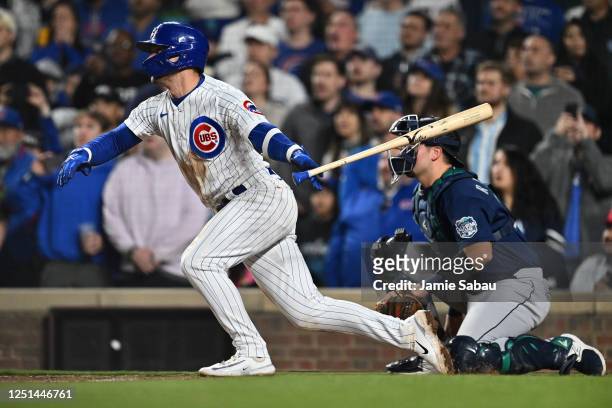 Nico Hoerner of the Chicago Cubs hits a walk-off RBI single in the 10th inning, scoring Nick Madrigal against the Seattle Mariners at Wrigley Field...