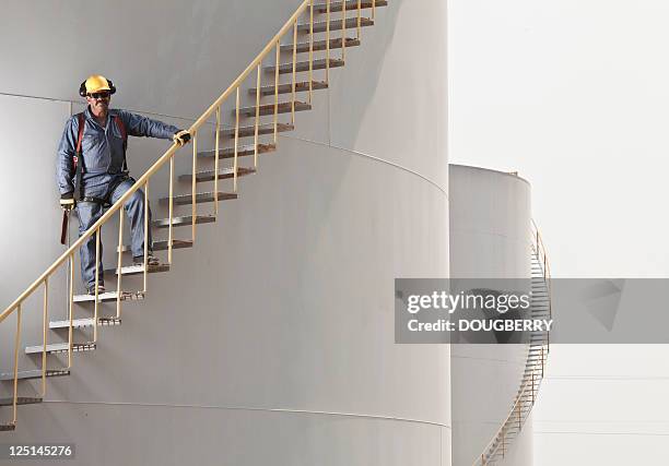 industrial worker - gasoline storage stock pictures, royalty-free photos & images