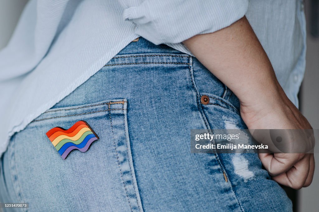 Close Up Of Woman Wearing Rainbow Badge