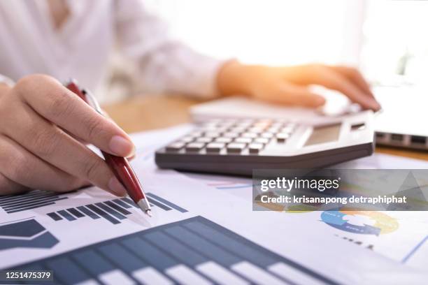 business investment analysis,account and accounting concept,business investment analysis - - business people and paper imagens e fotografias de stock