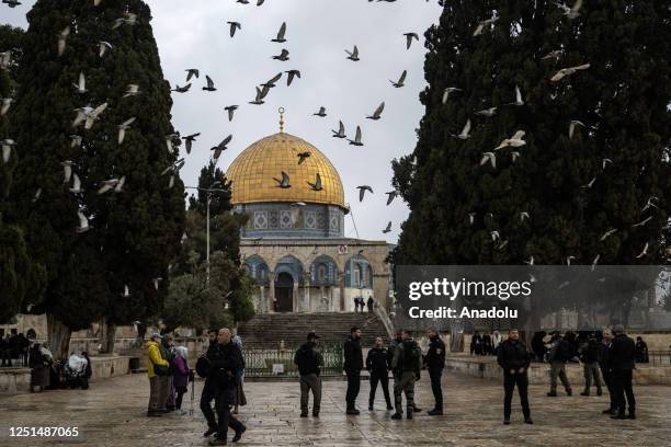 Far-right Jewish settlers guarded by Israeli police raid the courtyard of Al-Aqsa Mosque in East Jerusalem on April 11, 2023.