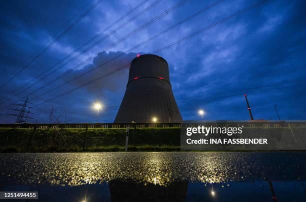 Photo taken on April 10, 2023 shows a cooling tower of the nuclear power plant Emsland in Lingen, western Germany. - Germany will shut down its three...