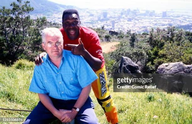 Kevin Cahill and Lenny Henry during the filming of Comic Relief's Great Big African Excellent Adventure documentary series in which a message was...