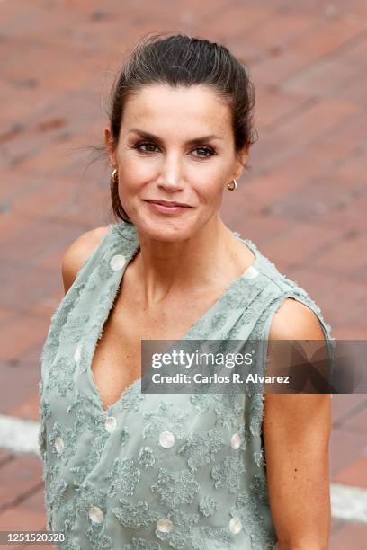 Queen Lelizia of Spain walks the Paseo de Las Canteras as the Kings hold a meeting with business, union and professional representatives from the...