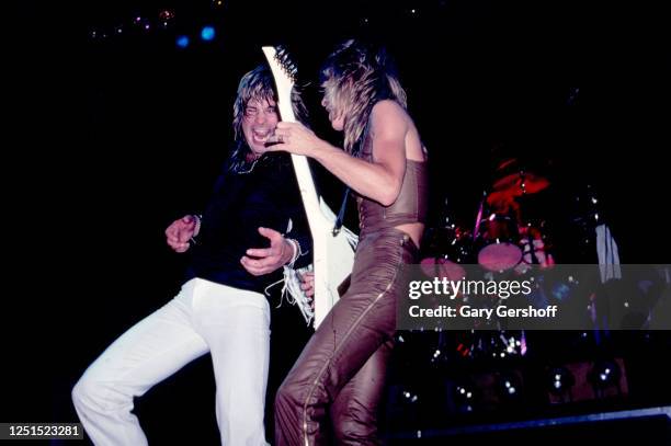 View of British Heavy Metal singer Ozzy Osbourne and American musician Randy Rhoads , on guitar, as they perform, during the 'Blizzard of Ozz Tour,'...