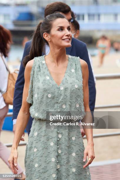 Queen Lelizia of Spain walks the Paseo de Las Canteras as the Kings hold a meeting with business, union and professional representatives from the...