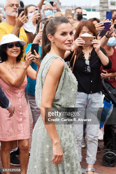 Queen Lelizia of Spain walks the Paseo de Las Canteras as the Kings hold a meeting with business, union and professional representatives from the...
