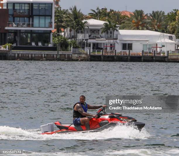 Mike Pouncey of Los Angeles Chargers of the National Football League seen on jet ski following his brother Maurkice Pouncey on their speedboat with a...