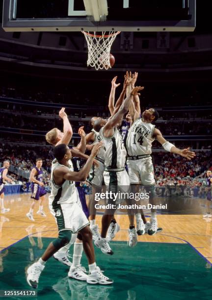 Charlie Bell, Guard for the Michigan State Spartans battles for the rebound during the NCAA Big-10 Conference tournament college basketballl game...