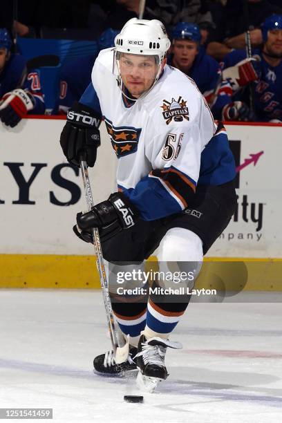 Sergei Gonchar of the Washington Capitals skates with the puck during a NHL hockey game against the New York Rangers at MCI Center on January 15,...