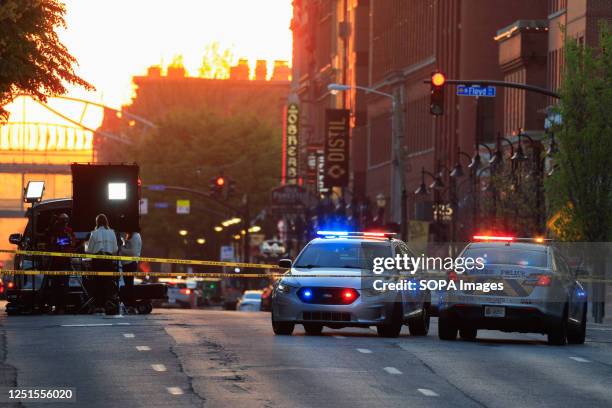 Police cars and cordon tape block Main Street near the Old National Bank after a mass shooting in Louisville, Kentucky. A gunman opened fire inside...